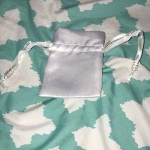 Mini white drawstring jewelry bag